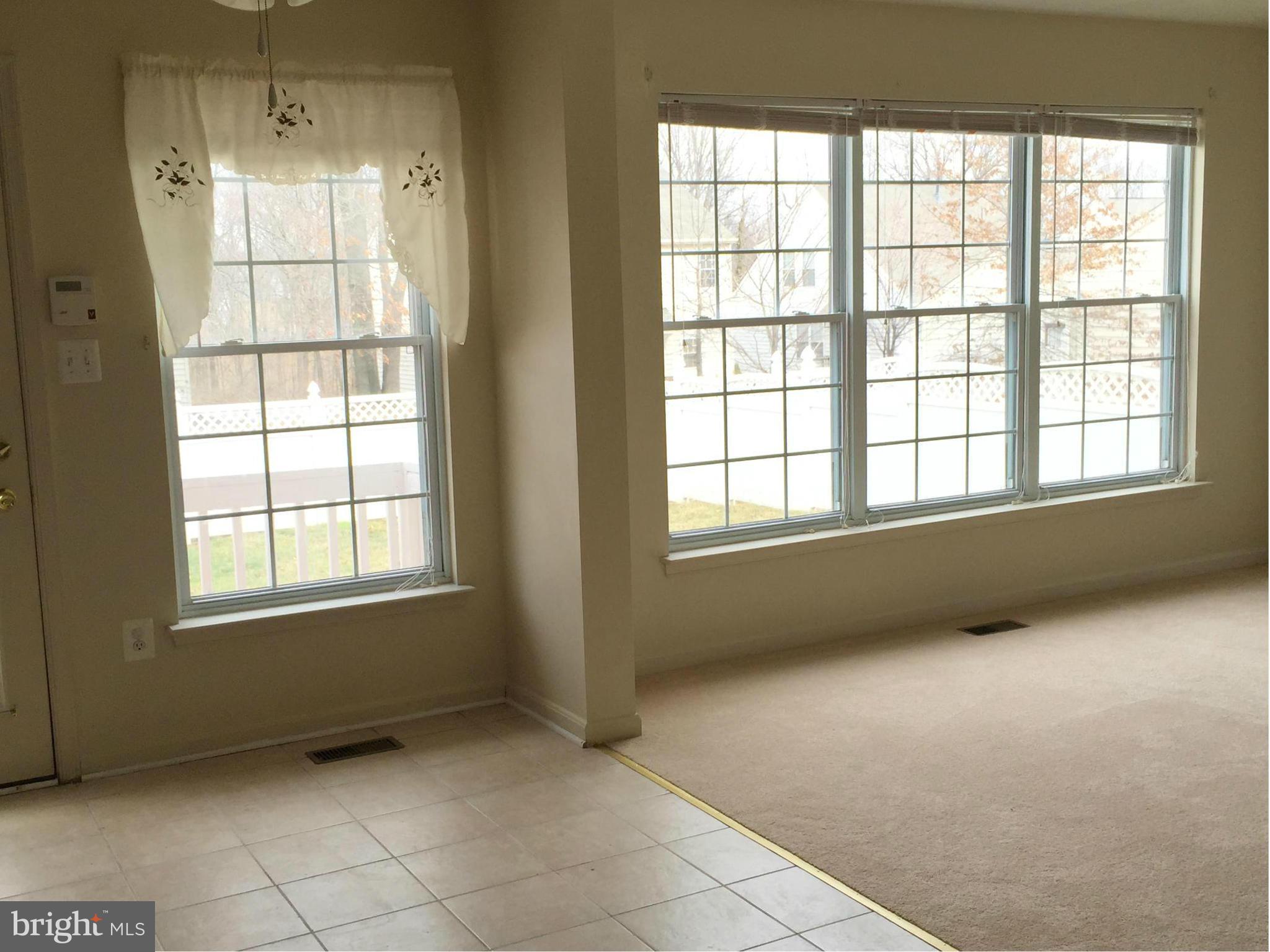 116 Commodore Drive Baltimore, MD 21221 - Photo 16 of 25 a view of an empty room with a window
