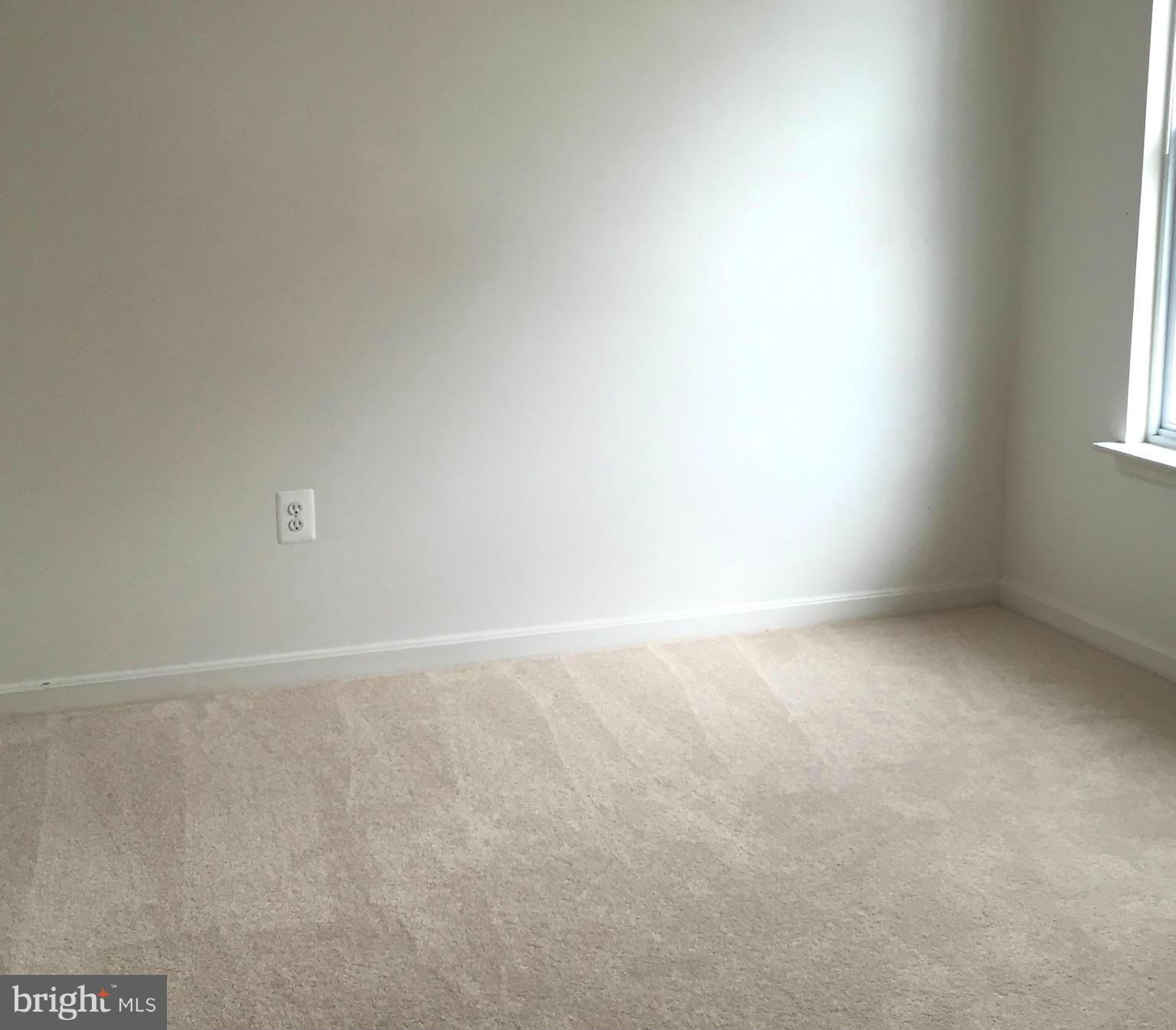 116 Commodore Drive Baltimore, MD 21221 - Photo 18 of 25 a view of an empty room and a window
