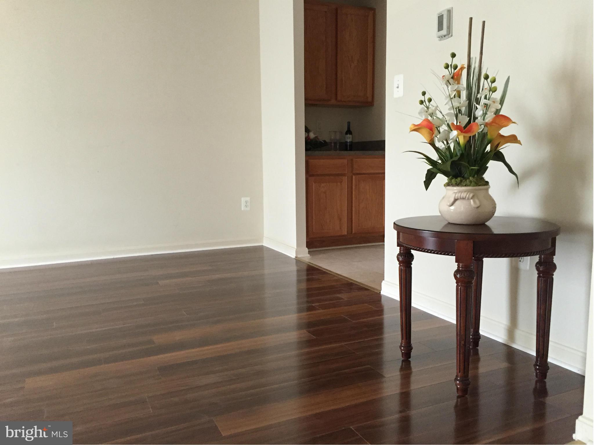 116 Commodore Drive Baltimore, MD 21221 - Photo 8 of 25 a view of a room with furniture and wooden floor