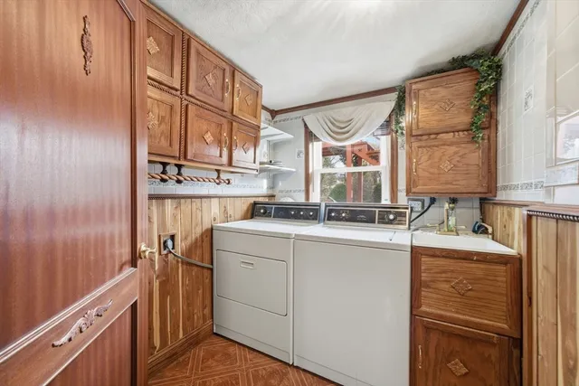 a kitchen with a sink cabinets and a window