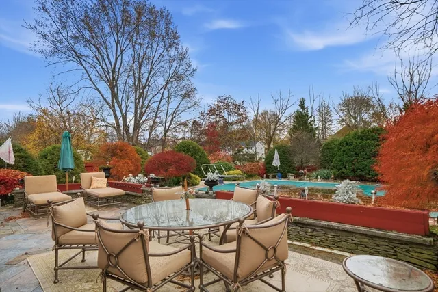 a view of a chairs and table in patio
