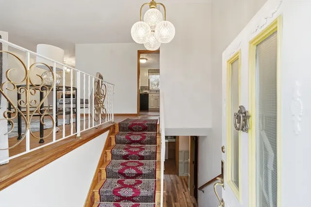 a view of a hallway with seating area