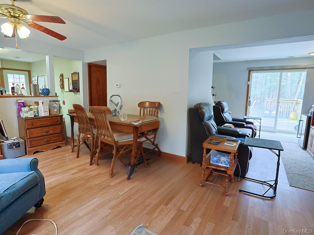 68 Kennel Road Cuddebackville, NY 12729 - Photo 7 of 21 a dining room with furniture and wooden floor