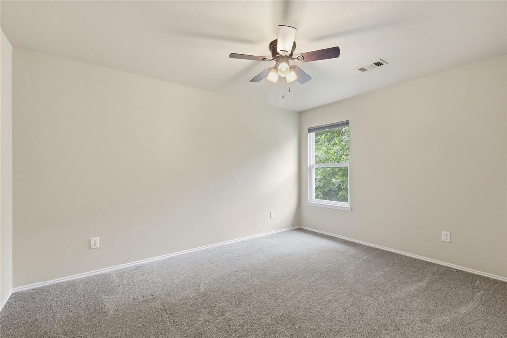 13236 Ridgepointe Road Fort Worth, TX 76244 - Photo 12 of 19 an empty room with a window and a fan