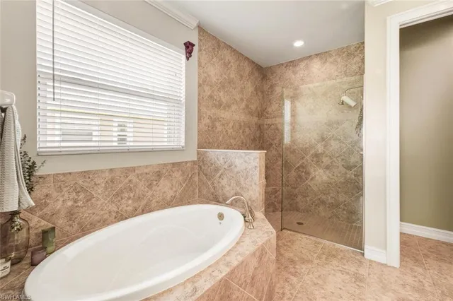 a bathroom with a bathtub and shower