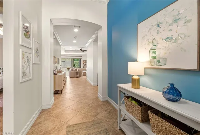 a view of hallway with furniture and livingroom