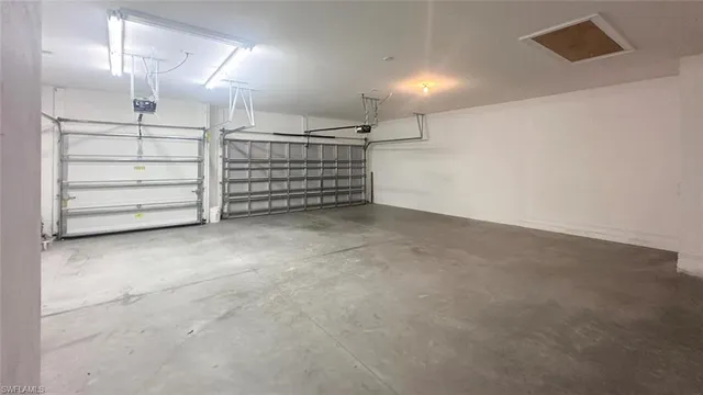 a view of an empty room with white walls