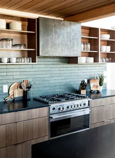 a kitchen with stainless steel appliances and cabinets