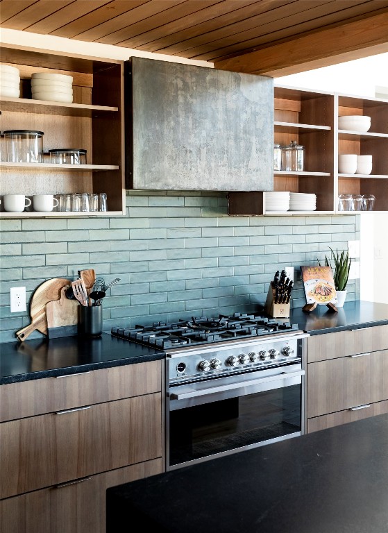 9361 Highway 290, Unit 107 Hye, TX 78635 - Photo 14 of 40 a kitchen with stainless steel appliances and cabinets