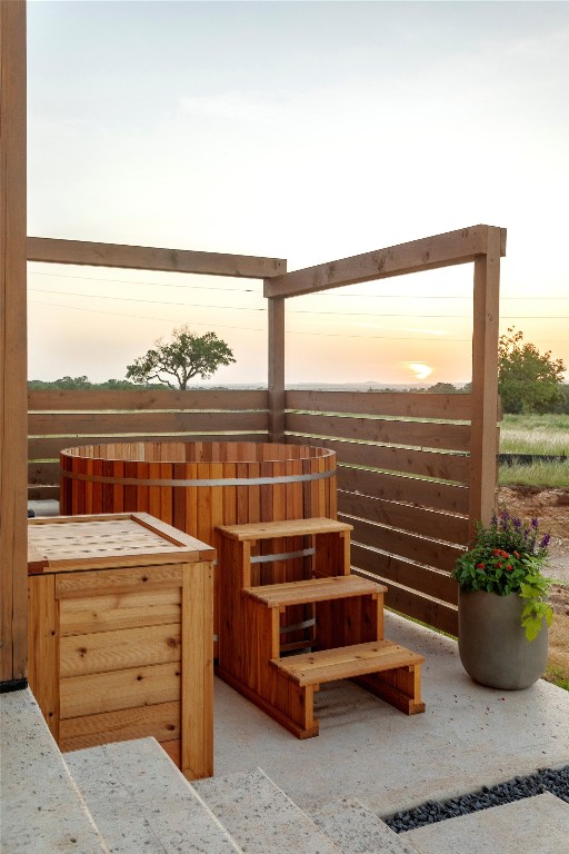 9361 Highway 290, Unit 107 Hye, TX 78635 - Photo 29 of 40 a room with furniture and a floor to ceiling window