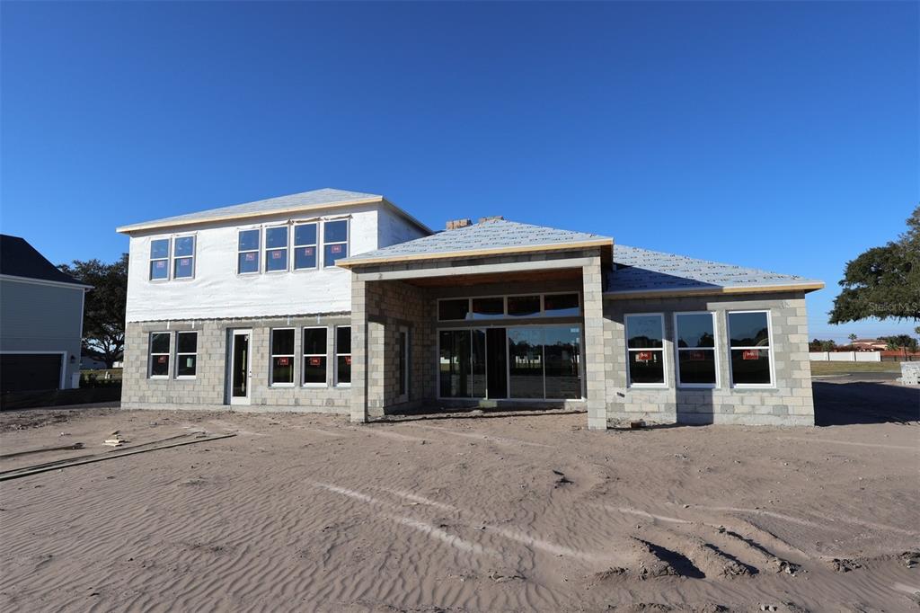 17036 Overstory Road Orlando, FL 32820 - Photo 15 of 19 a front view of a building with a garden