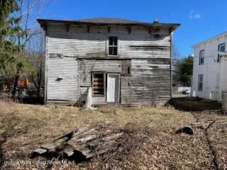 a front view of a house with parking space
