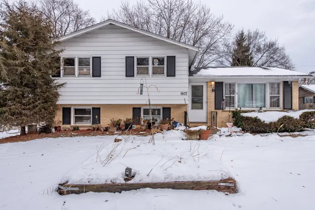 a view of a house with snow in the yard