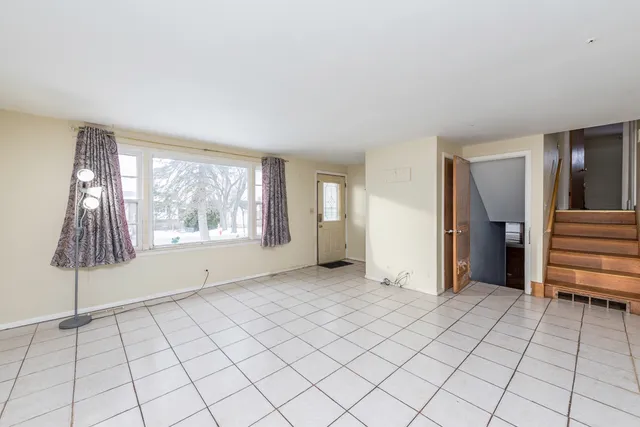 a kitchen with a sink cabinets and appliances