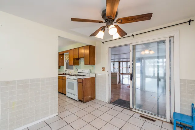a kitchen with a stove a sink and a refrigerator