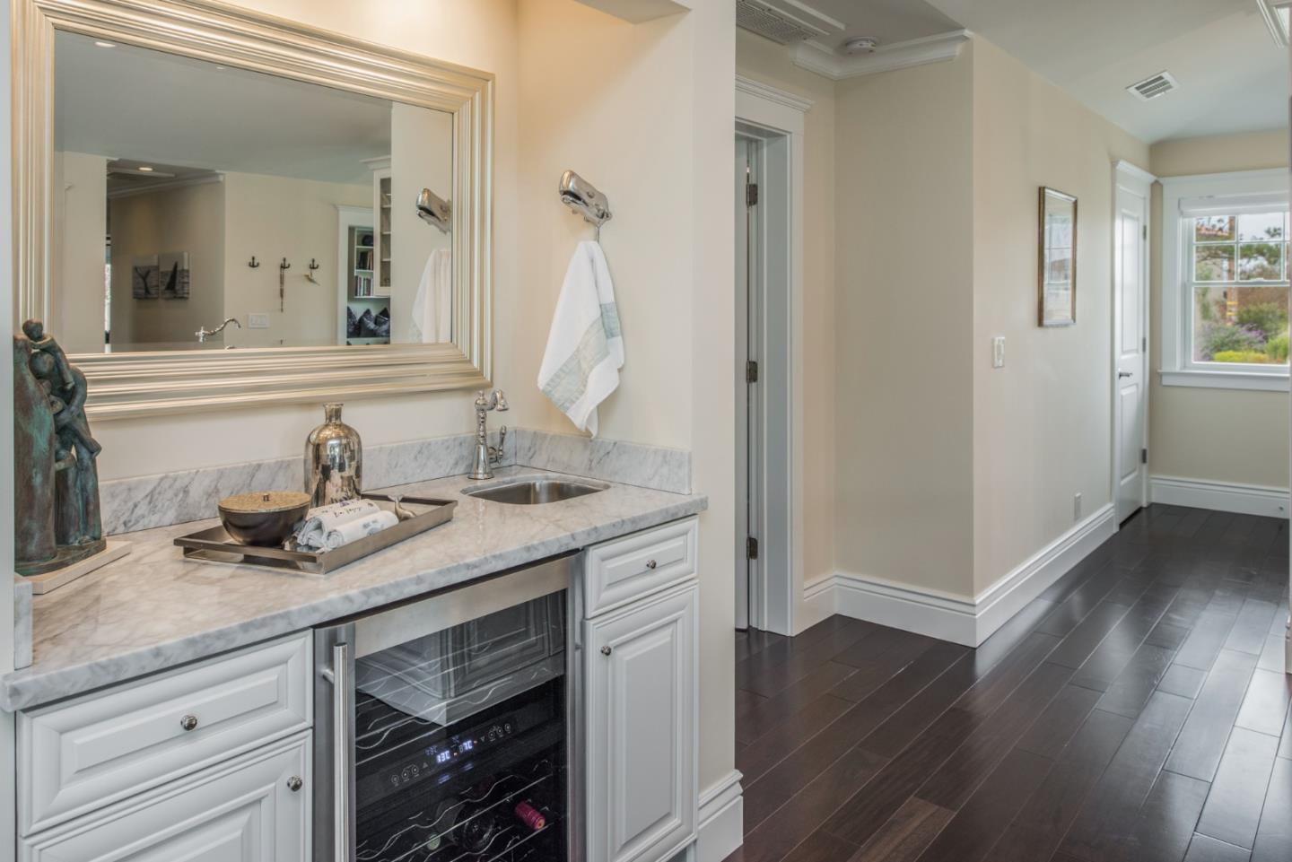 3039 Valdez Road Pebble Beach, CA 93953 - Photo 11 of 30 a en suite bathroom with a granite countertop sink and a mirror