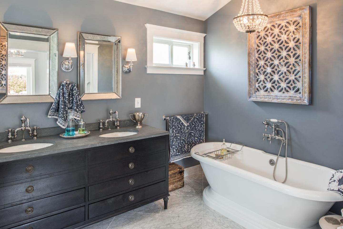 3039 Valdez Road Pebble Beach, CA 93953 - Photo 16 of 30 a bathroom with a tub sink and mirror