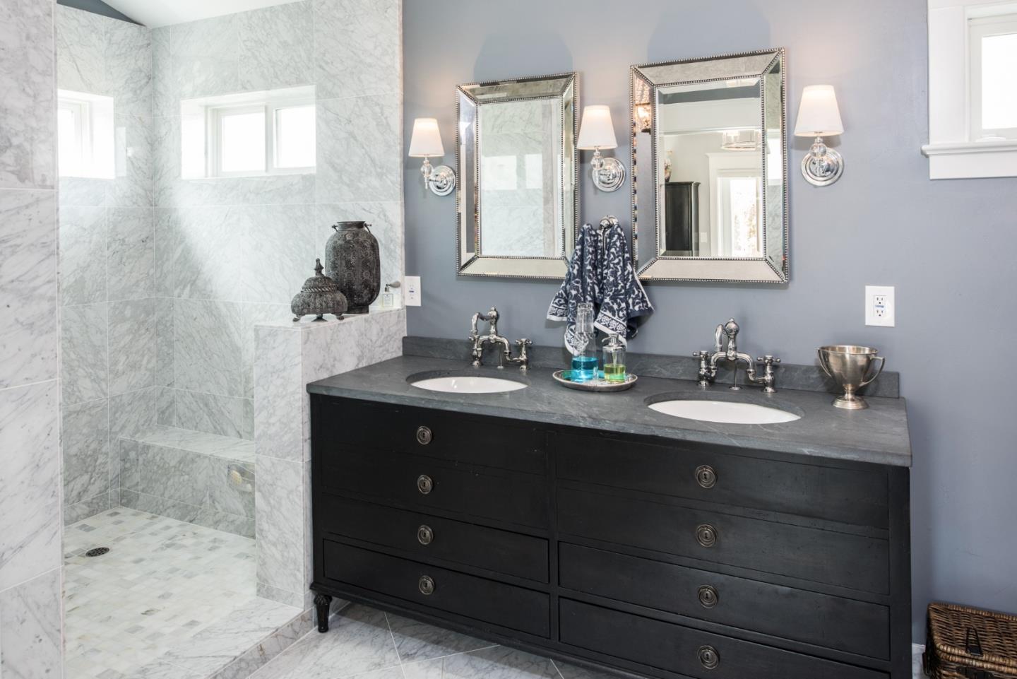 3039 Valdez Road Pebble Beach, CA 93953 - Photo 17 of 30 a bathroom with a sink double vanity and a mirror