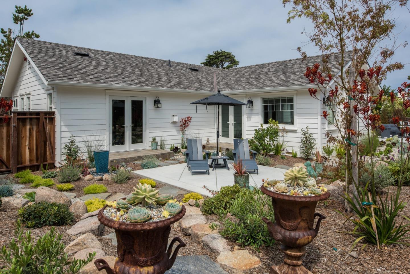 3039 Valdez Road Pebble Beach, CA 93953 - Photo 25 of 30 a view of a backyard with plants and patio