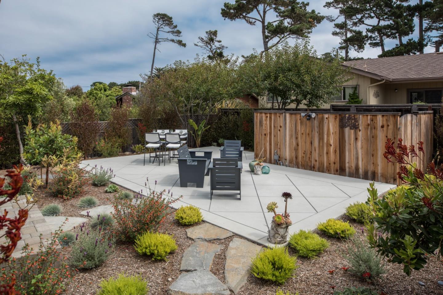 3039 Valdez Road Pebble Beach, CA 93953 - Photo 26 of 30 a view of a backyard with plants and a patio
