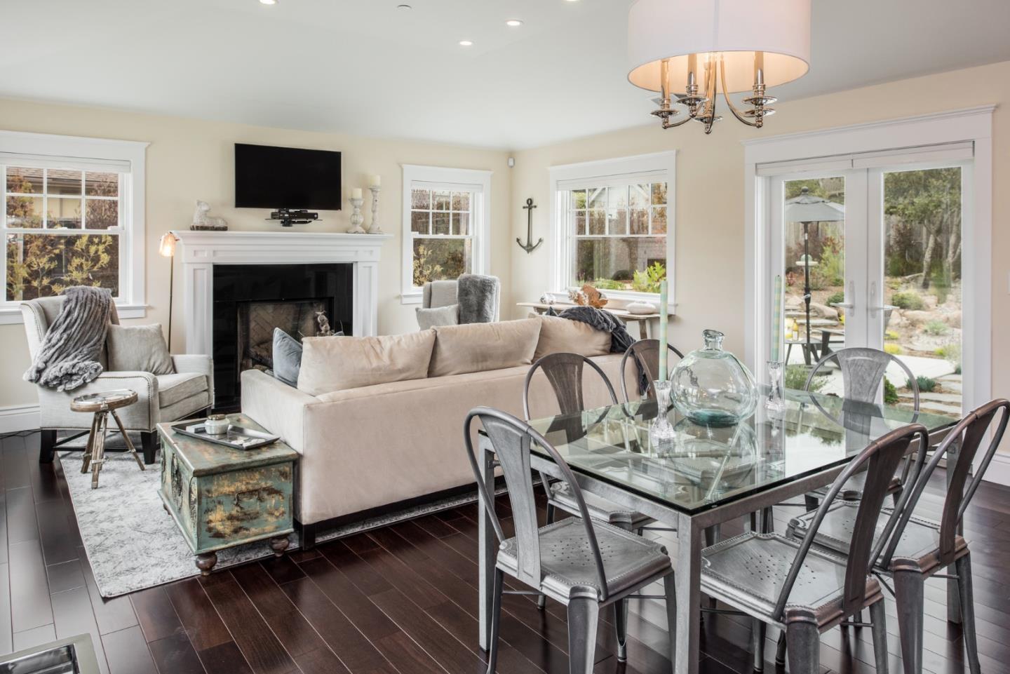 3039 Valdez Road Pebble Beach, CA 93953 - Photo 8 of 30 a living room with furniture a flat screen tv and a fireplace
