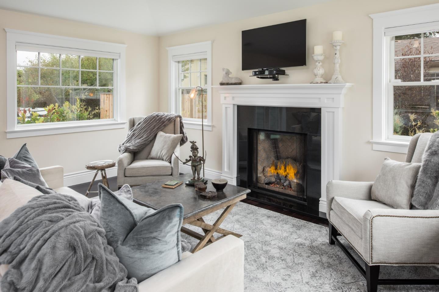 3039 Valdez Road Pebble Beach, CA 93953 - Photo 9 of 30 a living room with furniture a fireplace and a flat screen tv
