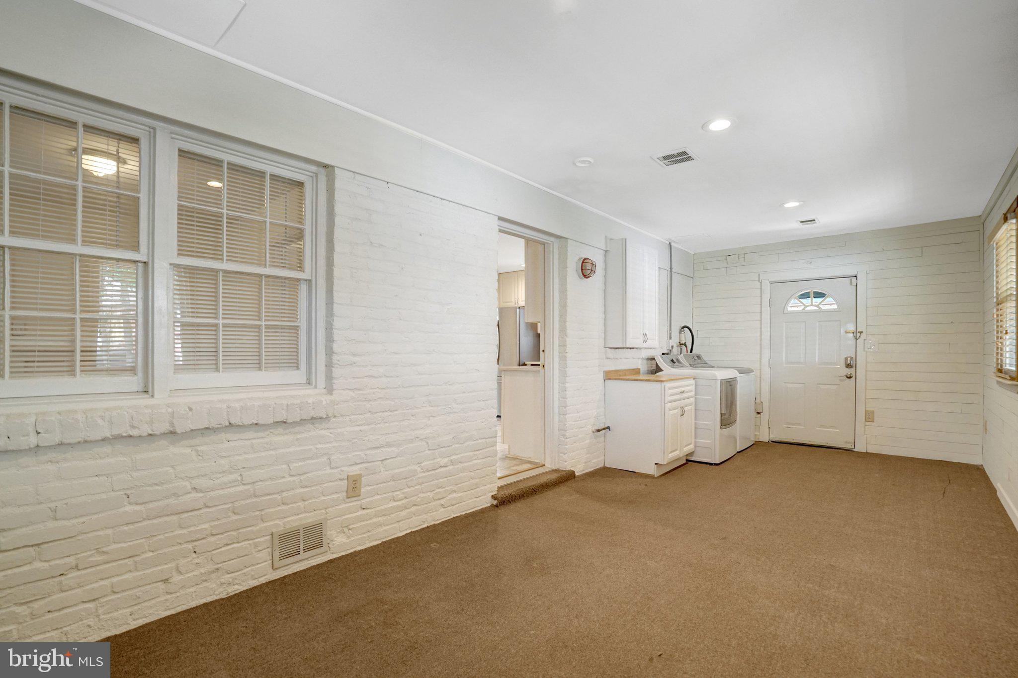 8015 New Market Road Alexandria, VA 22308 - Photo 35 of 41 Family room w/ laundry