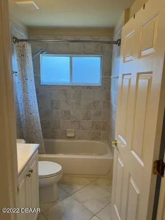 a view of a room with a large window
