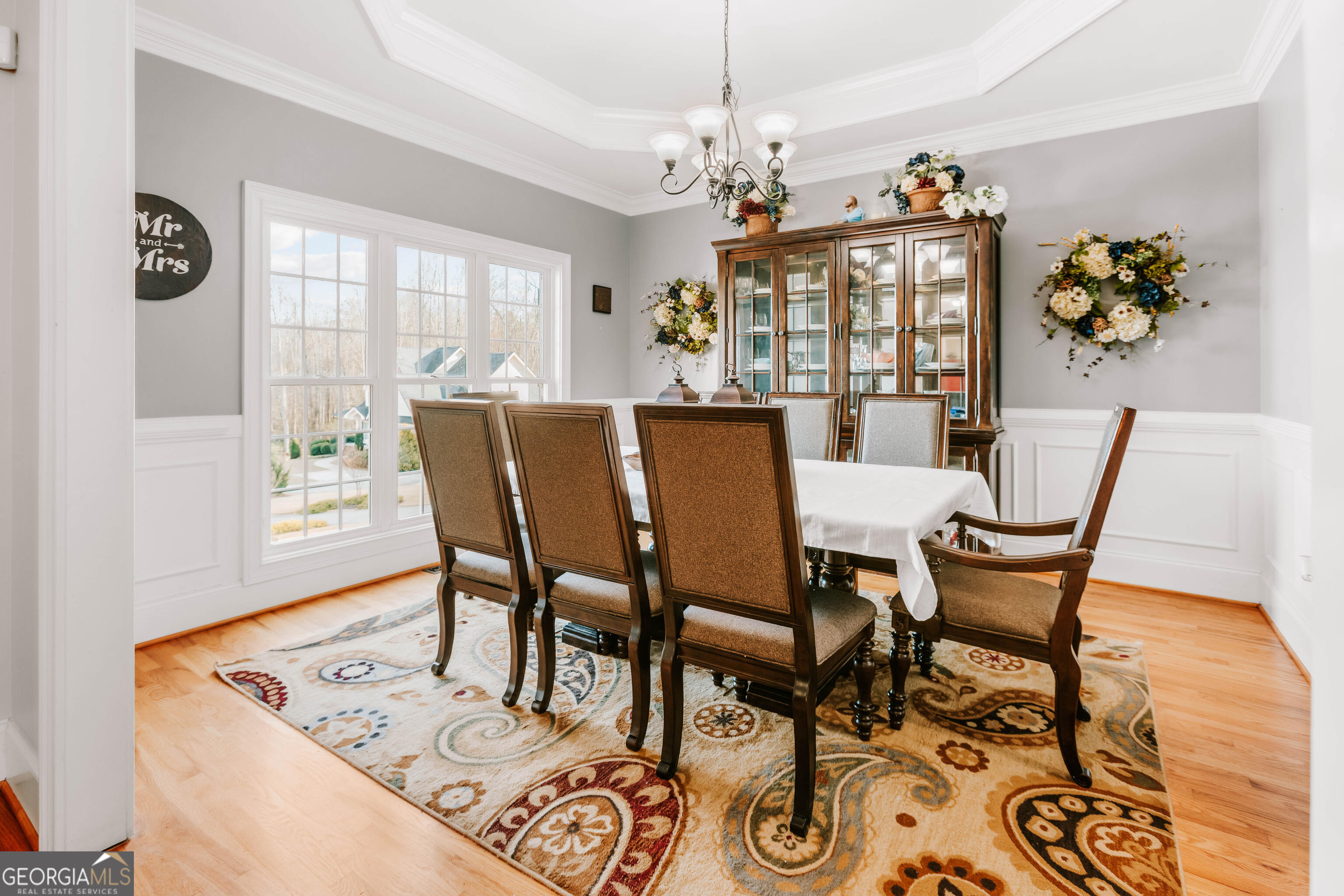 1001 Highpoint Lane Bogart, GA 30622 - Photo 22 of 49 a view of a dining room with furniture wooden floor and chandelier