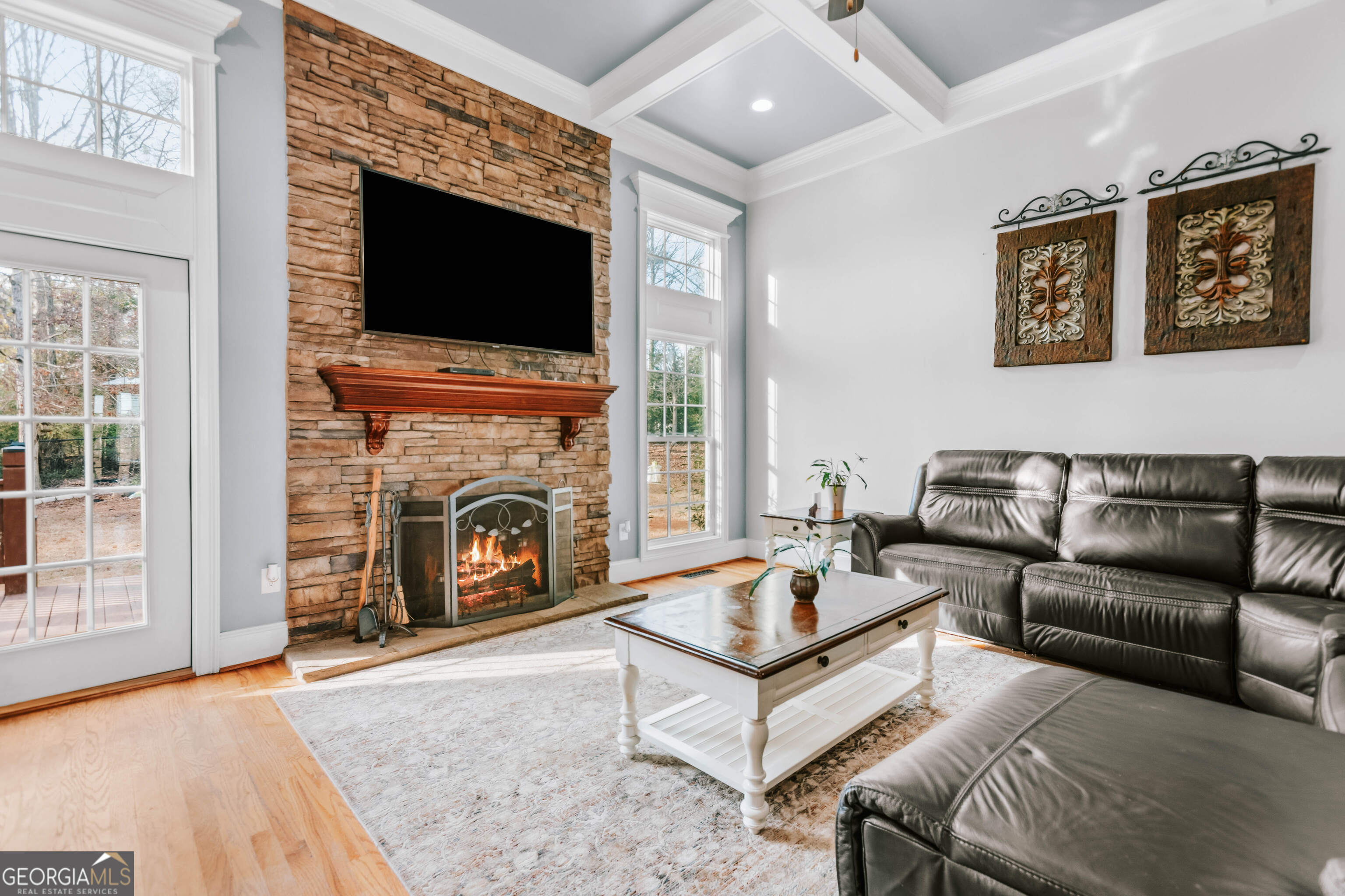 1001 Highpoint Lane Bogart, GA 30622 - Photo 23 of 49 a living room with furniture a fireplace and a flat screen tv