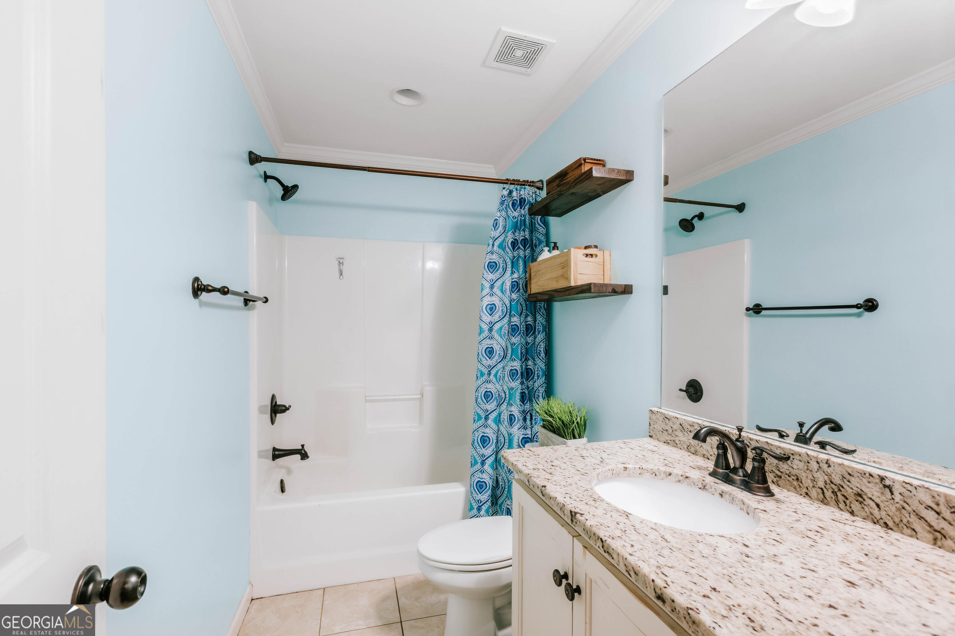 1001 Highpoint Lane Bogart, GA 30622 - Photo 38 of 49 a bathroom with a granite countertop sink a toilet and shower