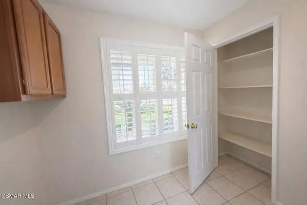 a view of an empty room with a window