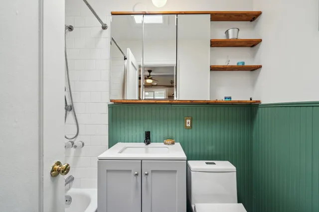a bathroom with a sink and toilet