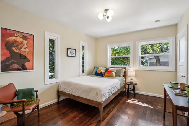 a bedroom with a bed and a table