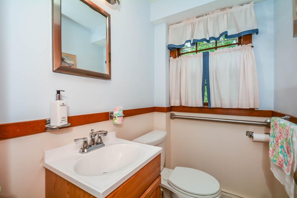 8 Balsam Road Reading, MA 01867 - Photo 16 of 30 a bathroom with a sink mirror vanity and toilet