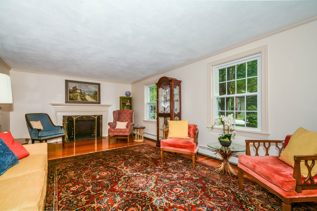 8 Balsam Road Reading, MA 01867 - Photo 6 of 30 a living room with furniture a rug and a window