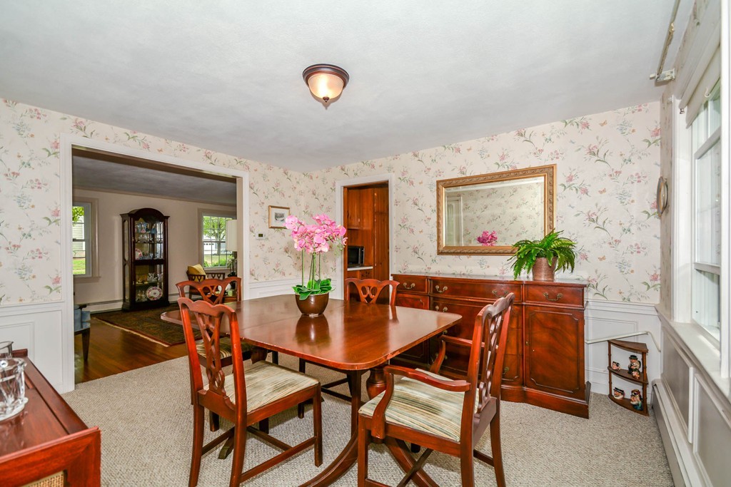 8 Balsam Road Reading, MA 01867 - Photo 8 of 30 a view of a dining room with furniture and wooden floor