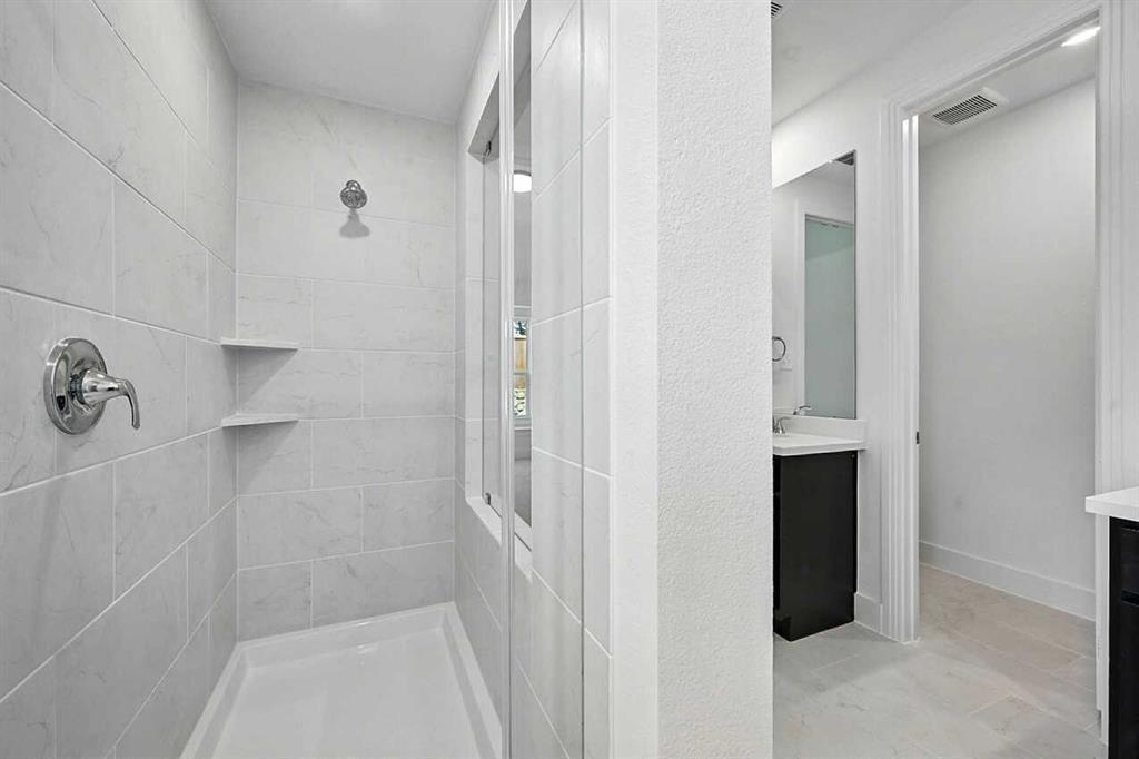 413 Heritage Rnch Trail Sherman, TX 75092 - Photo 12 of 30 a bathroom with a shower and a glass door