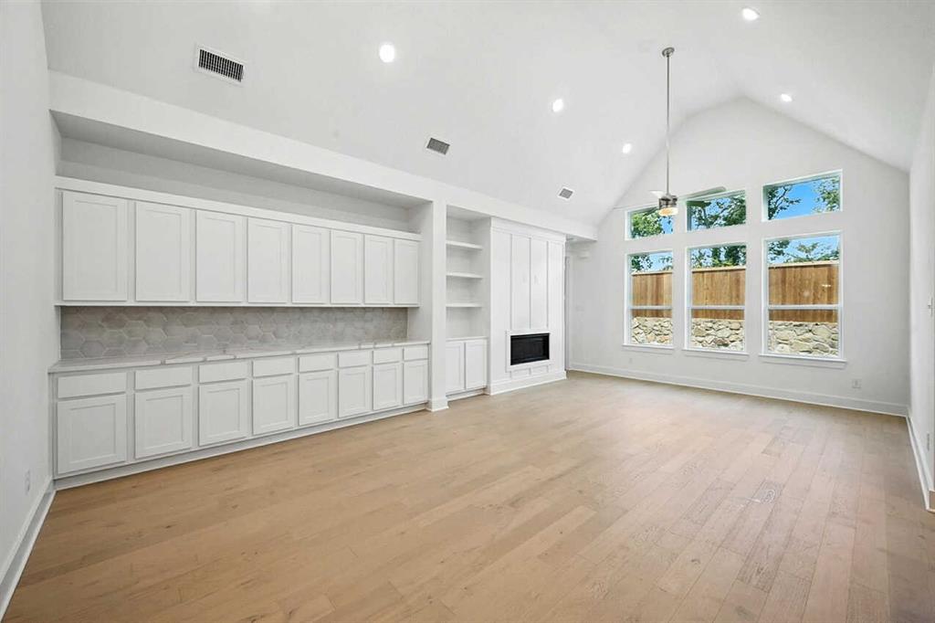 413 Heritage Rnch Trail Sherman, TX 75092 - Photo 27 of 30 a view of an empty room with window and cabinet