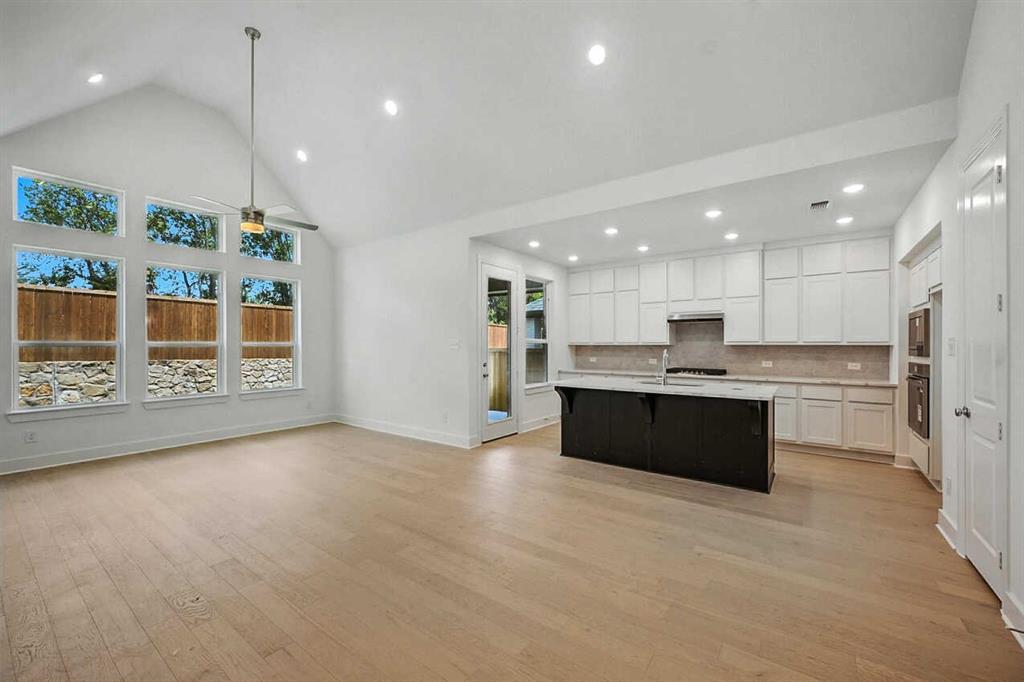 413 Heritage Rnch Trail Sherman, TX 75092 - Photo 28 of 30 a large kitchen with a large counter top appliances and cabinets