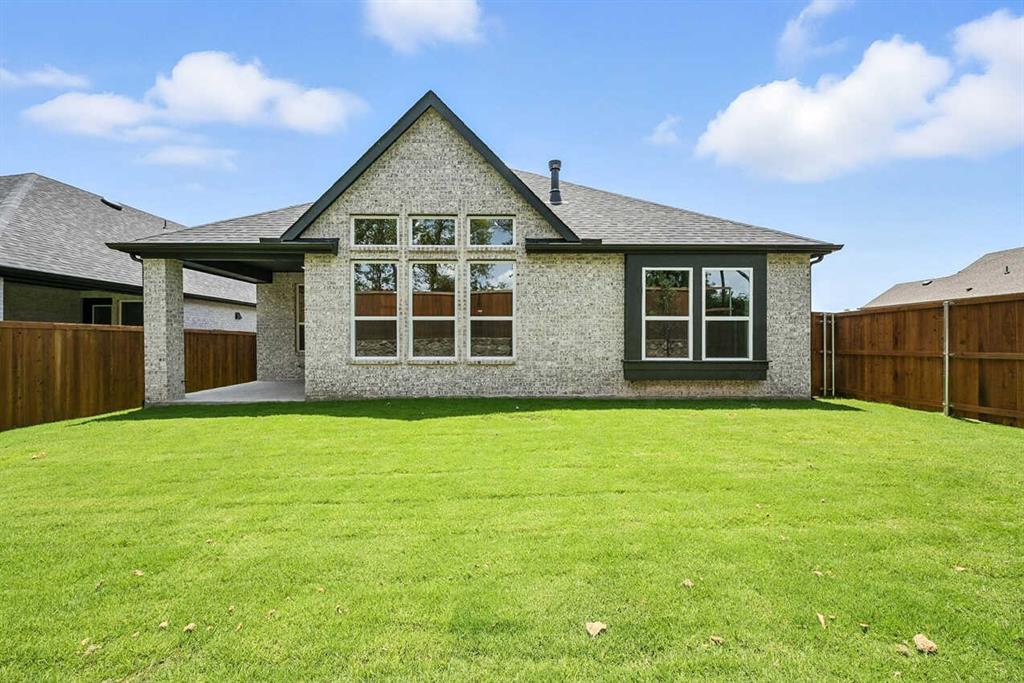 413 Heritage Rnch Trail Sherman, TX 75092 - Photo 29 of 30 a front view of a house with a yard