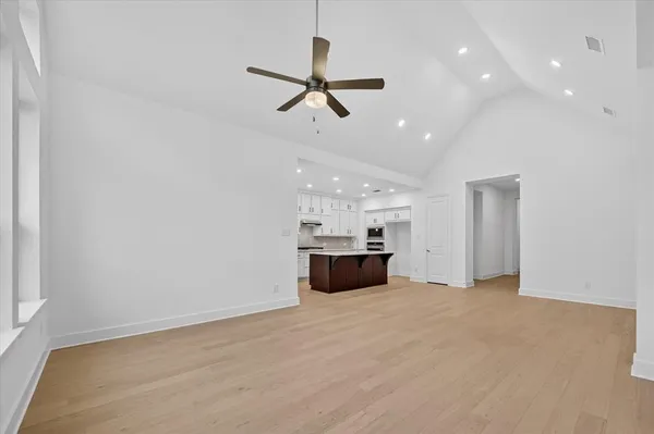 a view of a big room with windows and cabinet
