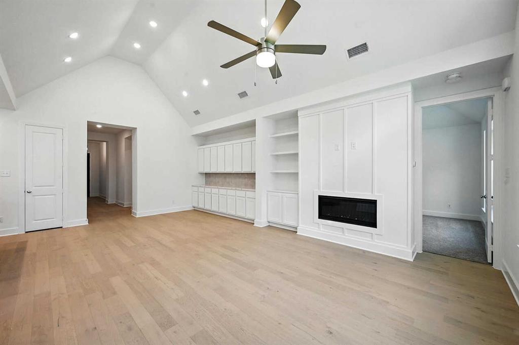 413 Heritage Rnch Trail Sherman, TX 75092 - Photo 8 of 30 a view of an empty room with a cabinet and a ceiling fan