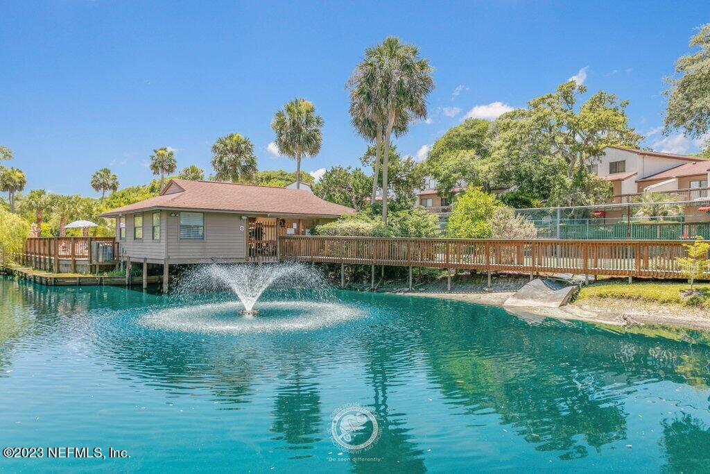 a swimming pool with outdoor seating and yard