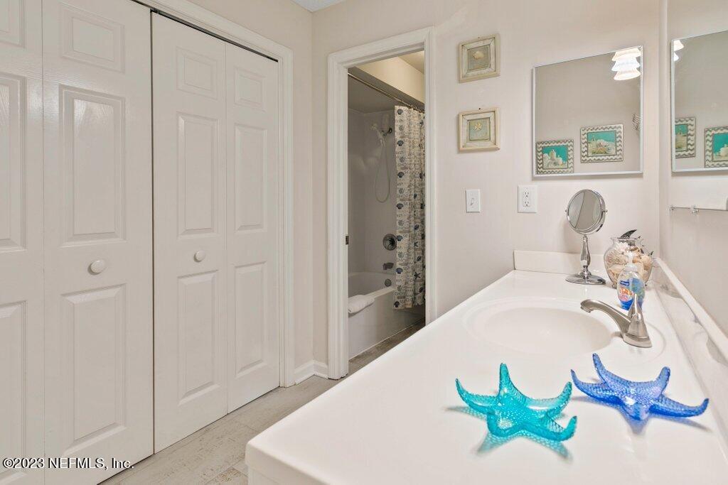2694 Forest Ridge Drive, Unit 4A Fernandina Beach, FL 32034 - Photo 20 of 38 a white bath tub sitting next to a white sink