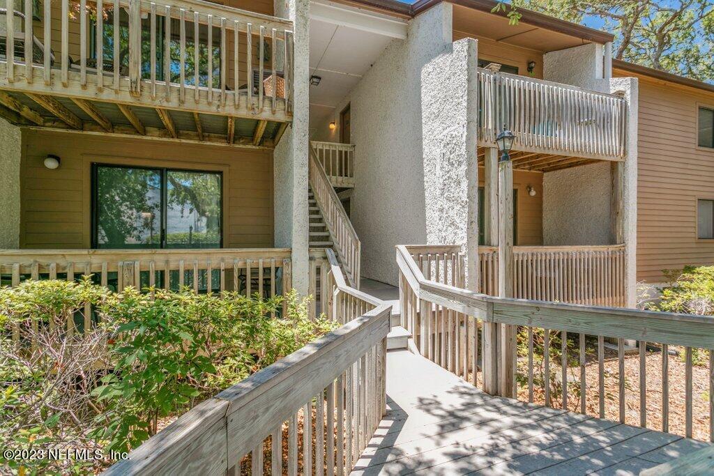 2694 Forest Ridge Drive, Unit 4A Fernandina Beach, FL 32034 - Photo 2 of 38 a view of a balcony with wooden floor
