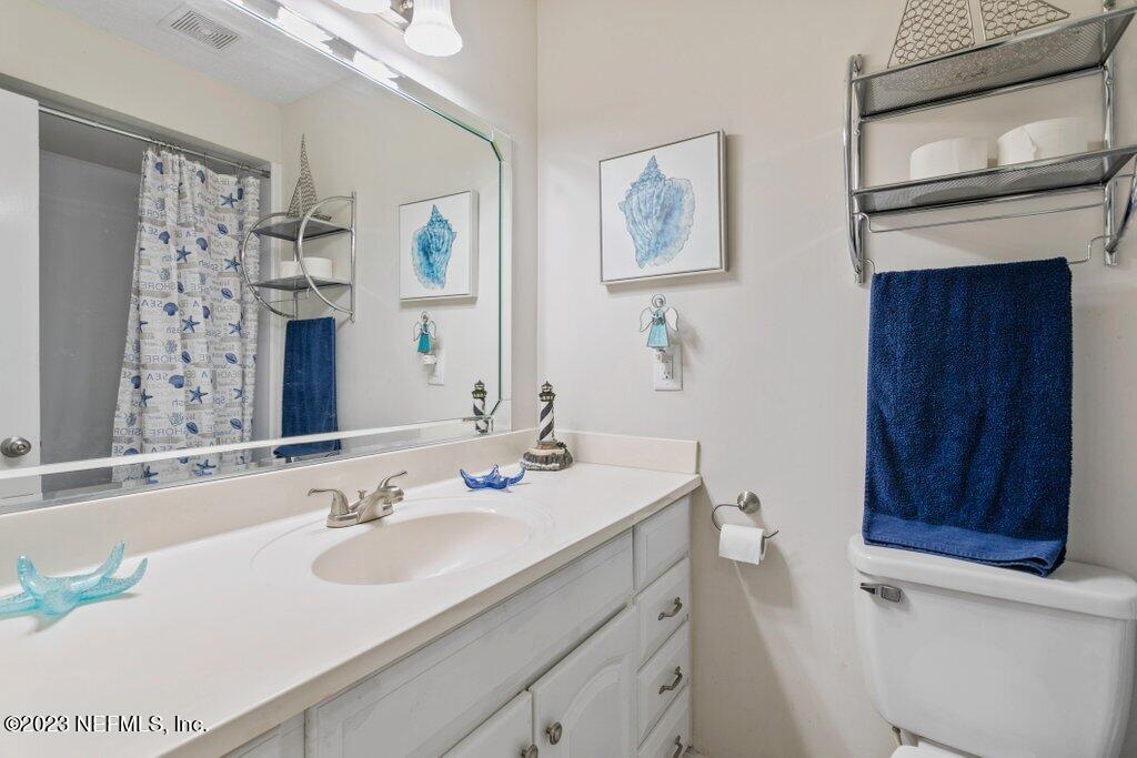 2694 Forest Ridge Drive, Unit 4A Fernandina Beach, FL 32034 - Photo 26 of 38 a bathroom with a sink and a mirror