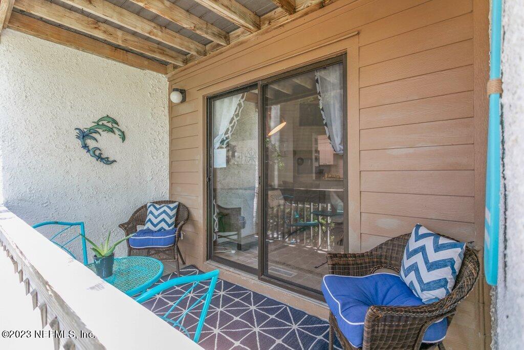 2694 Forest Ridge Drive, Unit 4A Fernandina Beach, FL 32034 - Photo 28 of 38 a living room with furniture and a potted plant