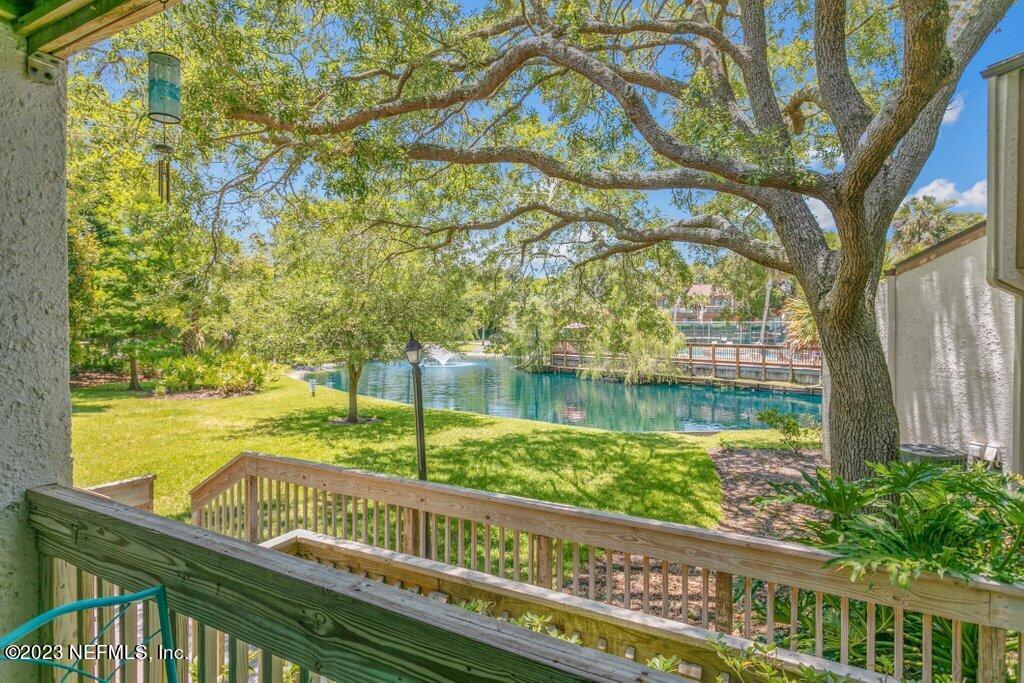 2694 Forest Ridge Drive, Unit 4A Fernandina Beach, FL 32034 - Photo 30 of 38 a view of a yard and lake from a balcony