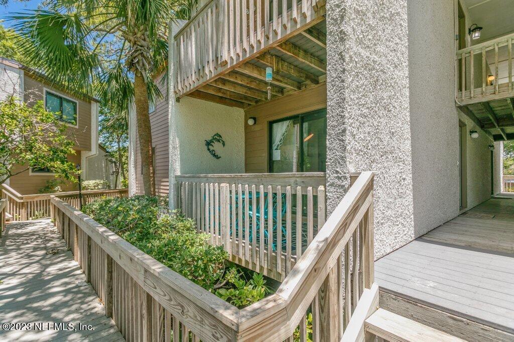2694 Forest Ridge Drive, Unit 4A Fernandina Beach, FL 32034 - Photo 3 of 38 a view of a house with wooden stairs